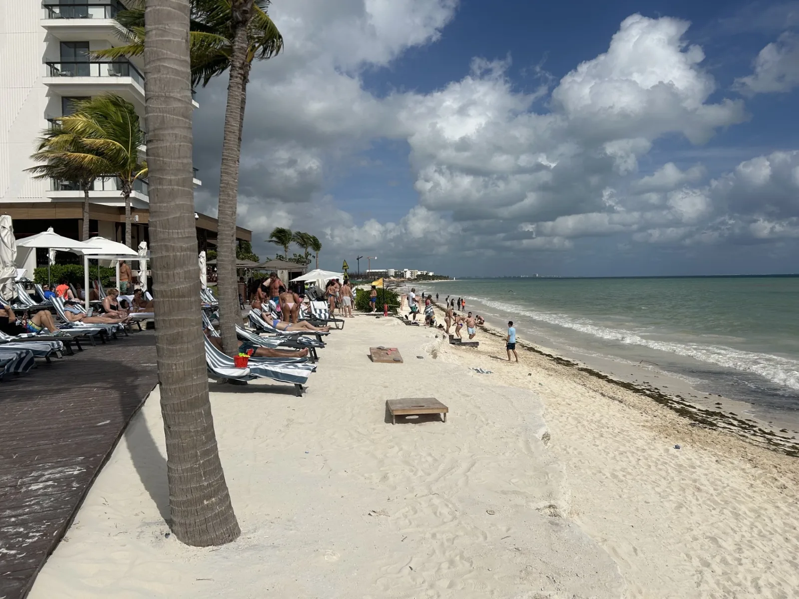 View of the decks with loungers, and sand shelf at Hilton Cancun
