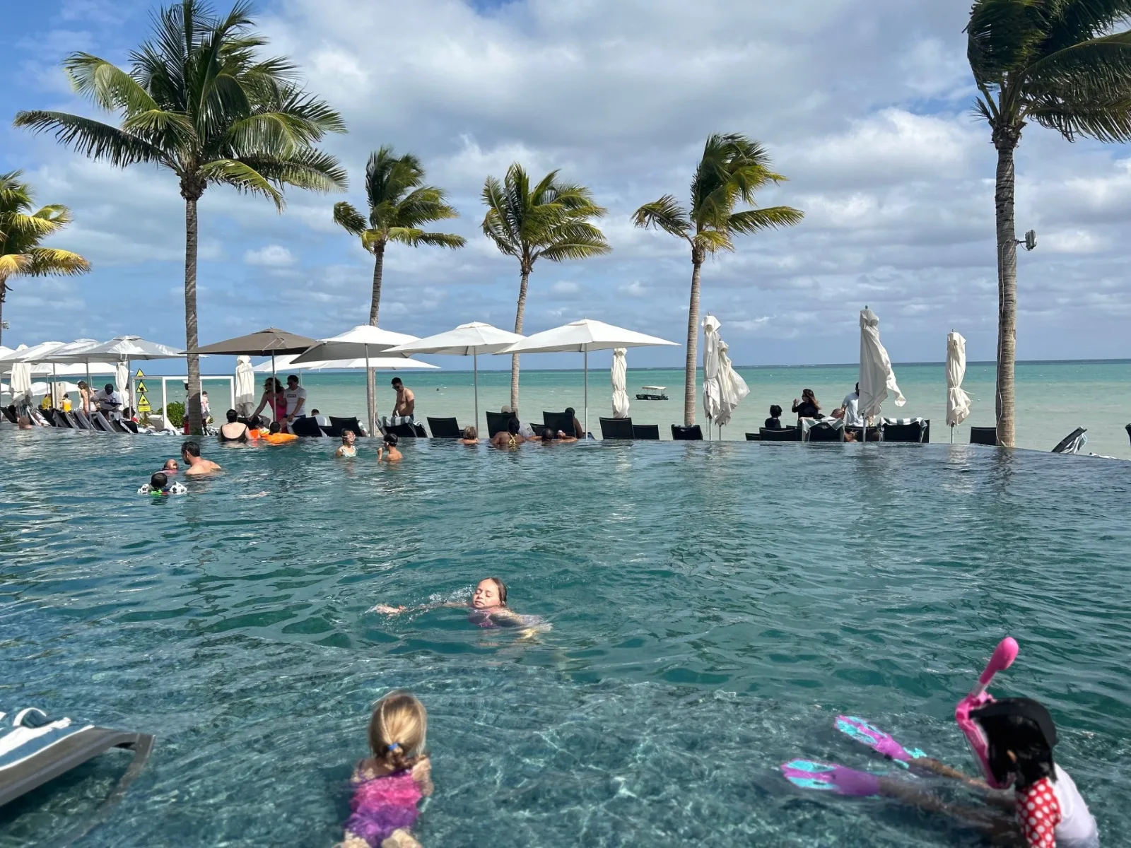 Swimming in the infinity pool (on the activity side) of the Hilton Cancun